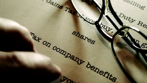 Finger-tapping-on-company-tax-document