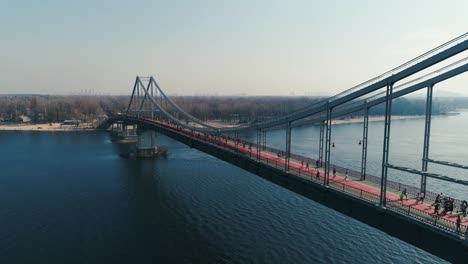 Marathon-running-on-the-footbridge.-Dolly-shot