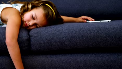 Girl-sleeping-on-sofa-in-living-room