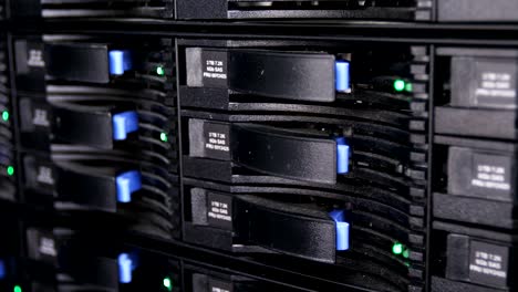 closeup-motion-past-crypto-mining-servers-with-green-and-blue-lights