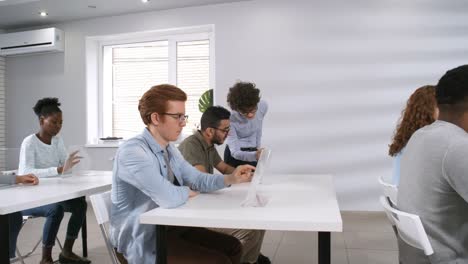 Female-College-Teacher-Giving-Lecture-with-Futuristic-Interactive-Devices