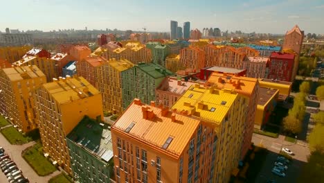 Flying-over-cozy-comfortable-colorful-buildings-in-a-European-city-4K-UHD-aerial