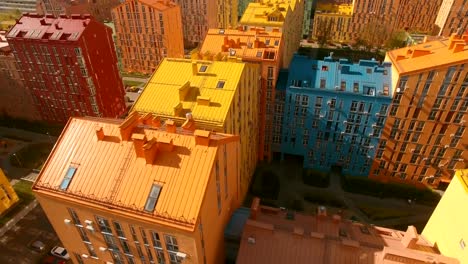 Flying-over-cozy-comfortable-colorful-buildings-in-a-European-city-4K-UHD-aerial