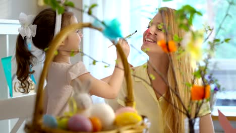 Happy-Easter!-Mother-and-her-daughter-having-fun-and-paint-each-other's-Bunnies-faces