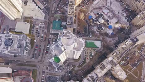 Top-view-of-a-skyscraper-and-modern-city-in-winter.-Clip.-Amazing-city-landscape