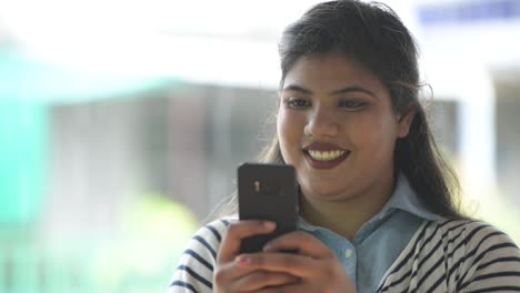 Young-overweight-beautiful-Indian-businesswoman-in-the-streets-outdoors