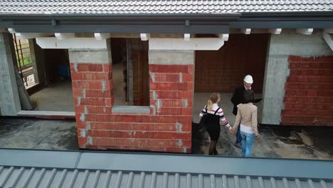 Construction-Site-With-Architect-And-Women-Buying-New-House