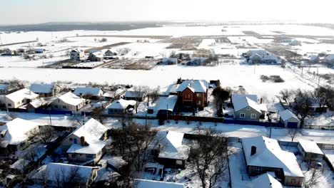 CHERKASY-REGION,-UKRAINE,-DECEMBER-25,-2018:-winter,-snow-covered-streets,-houses.-frosty-sunny-day.-aero,-view-from-above