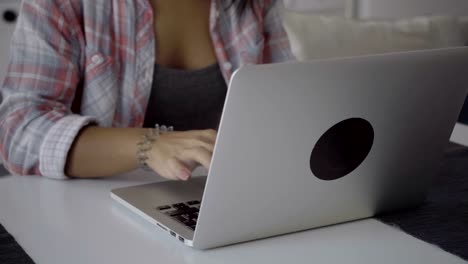 Cropped-shot-of-female-hands-typing-on-laptop.