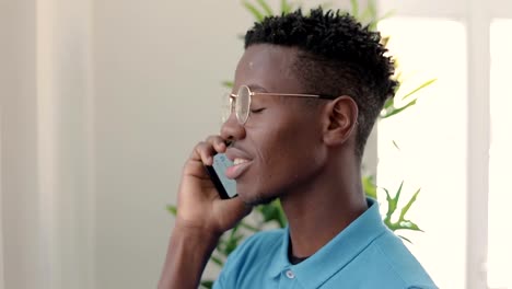 Handsome-african-american-young-man-talking-with-smartphone.