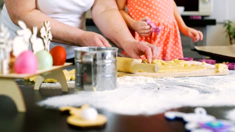 Grandmother-Helping-Granddaughter-make-Cookies