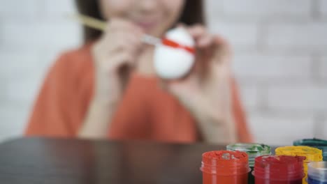 A-child-paints-Easter-eggs.