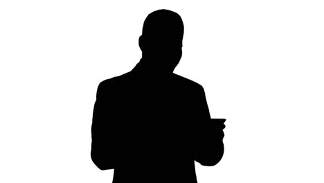 Silhouette-Businessman-Reading-oder-Working-on-a-digital-tablet