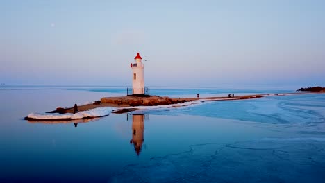 Aerial-winter-view-of-the-Tokarevskiy-lighthouse---one-of-the-oldest-lighthouses-in-the-Far-East,-still-an-important-navigational-structure-and-popular-attractions-of-Vladivostok-city,-Russia.