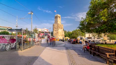 Clock-tower-in-the-Historic-part-of-Antalya-Kaleici-timelapse-hyperlapse,-Turkey.-Old-town-of-Antalya-is-a-popular-destination-among-tourists