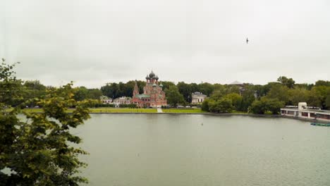 View-from-the-train-window.-You-can-see-the-pond-and-the-church