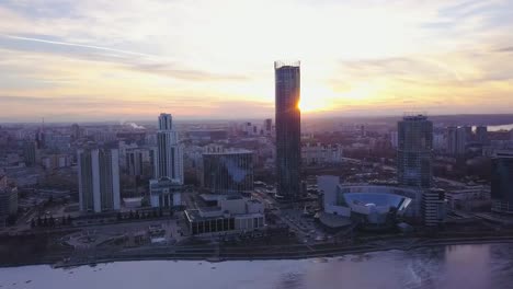 Sunset-in-megapolis.-Clip.-Beautiful-cityscape-with-top-view-on-skyscrapers.-Top-view-of-a-sunset-on-the-background-of-a-skyscraper