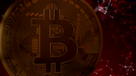 Bitcoin-rota-sobre-un-fondo-rojo-digital,-bucle-de-animación-en-3d.