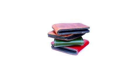 Group-wallet-of-leather-rotating-on-isolated