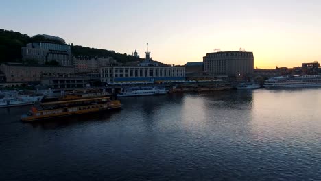 Excursion-passenger-ship-sails-to-the-port-of-the-old-European-city-at-sunset