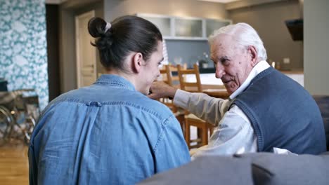 Young-Man-Talking-with-Elderly-Person