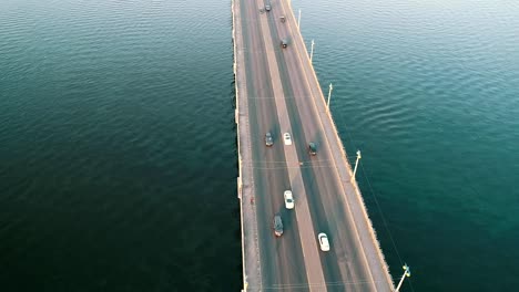 Aerial-top-view-of-bridge-road-automobile-traffic-of-many-cars,-transportation-concept