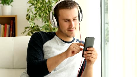 Guy-listening-music-relaxing-at-home