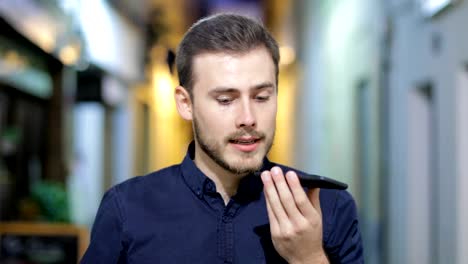 Man-using-phone-voice-recognition-to-send-a-message