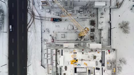 Aerial-view-of-building-construction-site-in-winter