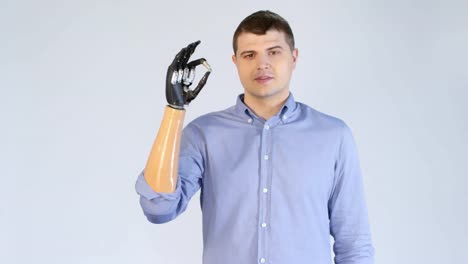 Amputee-Man-with-Prosthetic-Arm-Showing-OK