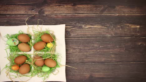 Eggs-and-Easter-decoration-on-wooden-background---Stop-motion