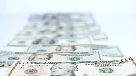 US-dollars-on-white-background.-Shifting-focus