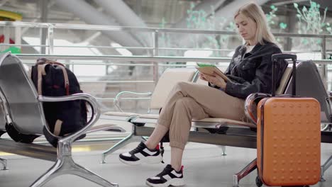 Woman-with-a-tablet-in-an-airport-terminal