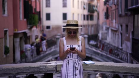 Millennial-caucasian-female-blogger-typing-text-for-article-with-information-about-travelling-around-Italy