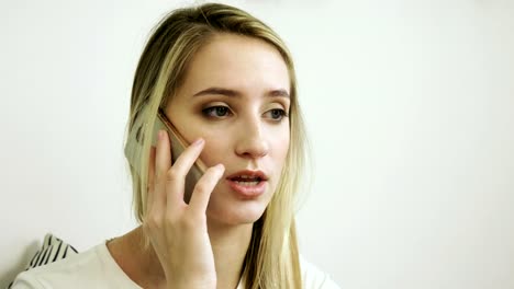 Beautiful-woman-using-mobile-phone-in-modern-cafe-and-talking-on-cell-phone.-4K