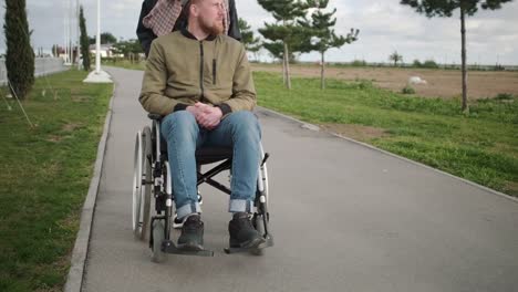 Outdoor-walk-with-disabled-husband