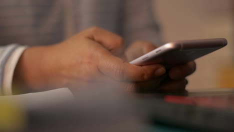 Close-up-woman-hands-texting-message-on-mobile-smart-phone-for-communication.