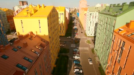 Flying-over-cozy-comfortable-colorful-buildings-in-a-European-city-4K-UHD-aerial