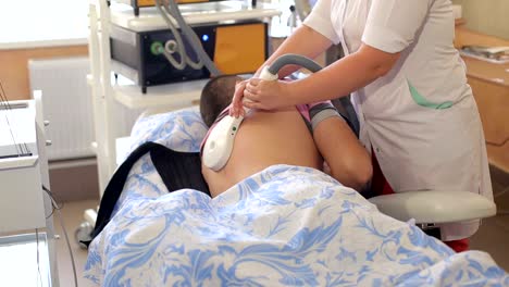 Electro-therapeutic-treatment-of-the-back.