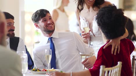 Couple-Socialising-At-Their-Wedding