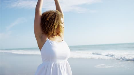 African-American-female-enjoying-summer-vacation-on-beach