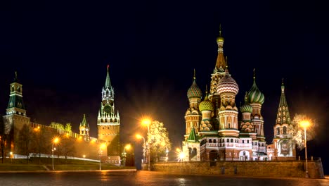 Intercession-Cathedral-(St.-Basil's)-and-the-Spassky-Tower-of-Moscow-Kremlin-at-Red-Square-in-Moscow.-Russia.-Night-illumination-and-snow-falling.