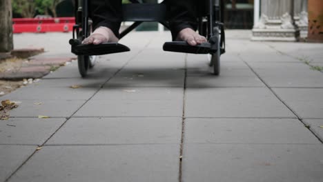 Patient-with-broken-leg-on-wheelchair-in-hospital