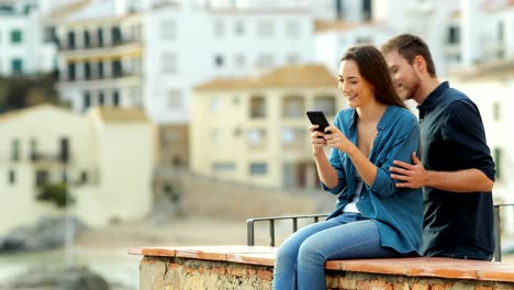 Woman-using-phone-until-her-boyfriends-arrives