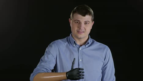 Cheerful-Man-with-Prosthetic-Arm-Showing-Thumbs-Up