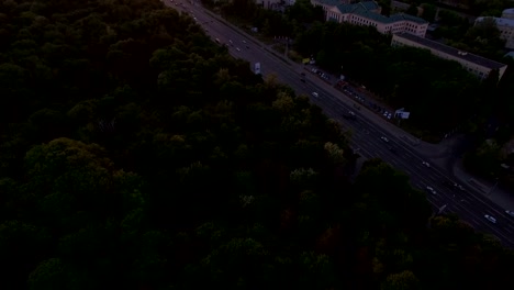 Green-city-on-the-background-of-a-beautiful-sunset-aerial