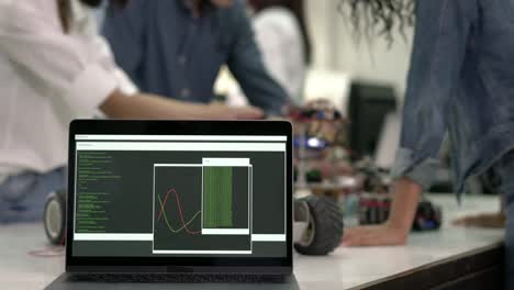 Laptop-updating-firmware-and-monitoring-software-for-collaborating-development-robot-in-modern-laboratory.-concept-of-hardware-technology,-robotic-engineering,-car-motor-and-automation-control.