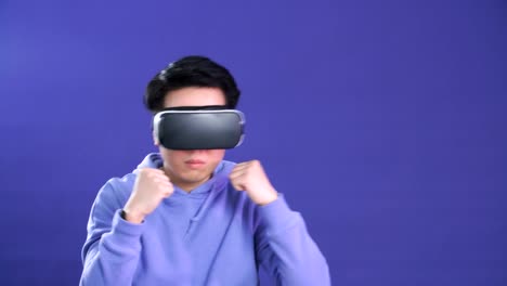 Man-using-virtual-reality-headset-at-office