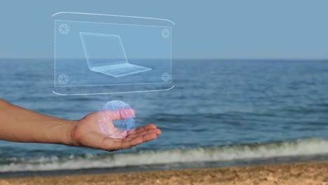 Manos-masculinas-en-la-playa-con-holograma-ultra-Laptop