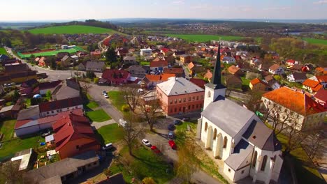 Camera-flight-over-small-village-Litice-suburb-of-Pilsen.-Living-in-agricultural-landscape.-Environmentally-friendly-living.-Czech-Republic,-Europe.